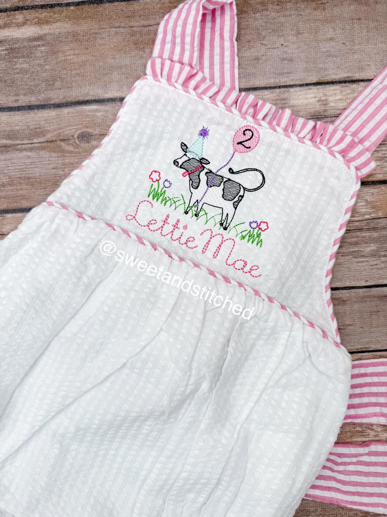 Monogrammed baby girl ruffle bubble with birthday cow design in pink and white seersucker, cow cake smash, cow 1st birthday outfit