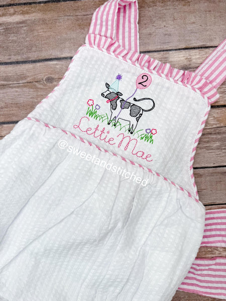Monogrammed baby girl ruffle bubble with birthday cow design in pink and white seersucker, cow cake smash, cow 1st birthday outfit