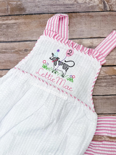 Monogrammed baby girl ruffle bubble with birthday cow design in pink and white seersucker, cow cake smash, cow 1st birthday outfit