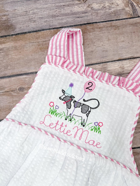 Monogrammed baby girl ruffle bubble with birthday cow design in pink and white seersucker, cow cake smash, cow 1st birthday outfit